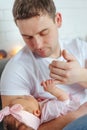 Close-up portrait of happy young father hugging and kissing his sweet adorable newborn child. Happy Family concept Royalty Free Stock Photo