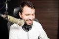 Male broadcaster at radio station Royalty Free Stock Photo