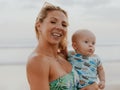 Close up portrait of happy young mother and baby son spending time on the beach. Family vacation. Summer. Mother\'s day. Royalty Free Stock Photo