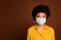 Close-up portrait of her she minded thoughtful dark skin wavy-haired lady wearing yellow shirt mask concept sickness Royalty Free Stock Photo