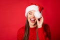 Close-up portrait of her she nice attractive cheerful cheery positive girl holding hat white ball closing eye laughing Royalty Free Stock Photo