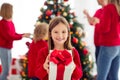 Close-up portrait of her she nice attractive cheerful girl holding in hands giving handling you giftbox December miracle Royalty Free Stock Photo