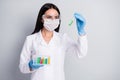 Close-up portrait of her she nice attractive girl biologist scientist doc holding in hands flasks making analysis world Royalty Free Stock Photo