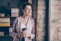 Close-up portrait of her she nice attractive smart clever cheerful dreamy lady looking at window drinking cacao planning Royalty Free Stock Photo