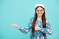 Close-up portrait of her she nice cute attractive cheerful amazed girl pointing aside on copy space isolated on blue Royalty Free Stock Photo