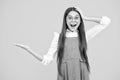 Close-up portrait of her she nice cute attractive cheerful amazed girl pointing aside on copy space isolated on yellow Royalty Free Stock Photo