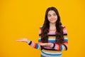 Close-up portrait of her she nice cute attractive cheerful amazed girl pointing aside on copy space isolated on yellow Royalty Free Stock Photo