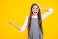 Close-up portrait of her she nice cute attractive cheerful amazed girl pointing aside on copy space isolated on yellow Royalty Free Stock Photo