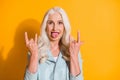 Close-up portrait of her she nice-looking attractive cheerful cheery gray-haired woman showing double horn sign having Royalty Free Stock Photo
