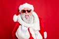 Close-up portrait of his he confident crazy naughty fat overweight plump gray-haired bearded man having fun showing horn Royalty Free Stock Photo