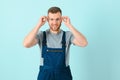 Close-up portrait of his he nice attractive cheerful cheery content guy repairer craftsman isolated over blue color background