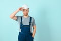 Close-up portrait of his he nice attractive cheerful cheery content guy repairer craftsman isolated over blue color background