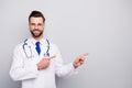 Close-up portrait of his he nice attractive confident cheerful cheery bearded guy pharmacy expert showing copy space new Royalty Free Stock Photo