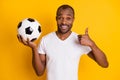 Close-up portrait of his he nice attractive content cheerful cheery guy holding in handball showing thumbup ad advert Royalty Free Stock Photo