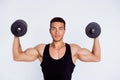 Close-up portrait of his he nice attractive muscular sportive perfect macho guy doing exercise lifting weight dumbbell Royalty Free Stock Photo