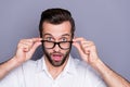 Close-up portrait of his he nice attractive successful funky wondered amazed man employee touching specs amazement