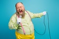 Close-up portrait of his he nice funny funky cheerful cheery dreamy bearded elderly man singing karaoke romance wedding Royalty Free Stock Photo