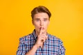 Close-up portrait of his he nice-looking attractive worried nervous guy wearing checked shirt showing shh sign keep dont Royalty Free Stock Photo