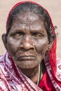 Close-up portrait of a homeless blind woman from India.