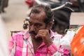 Close up portrait of an Indian man staring thoughtfully Royalty Free Stock Photo