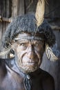 Close-up portrait of an Indigenous man from the Dani tribe, West Papua, Indonesia.