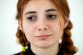 Close up portrait of innocent looking redhead pretty teenage girl