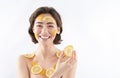 Joyful woman with lemon pieces on body