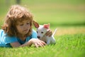 Close up portrait of kid hugging dog. Positive emotions of children. Funny kids playing with her puppy dog in the park