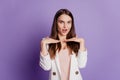 Close up portrait of lady hands face dreamy look wear formal suit posing on purple wall