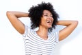 Close up laughing young african woman with hands in hair Royalty Free Stock Photo