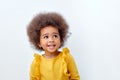 Close up portrait of little adorable African american child girl looking at side, having fun Royalty Free Stock Photo