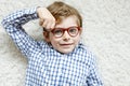 Close-up portrait of little blond kid boy with brown eyeglasses Royalty Free Stock Photo