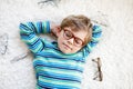 Close-up portrait of little blond kid boy with brown eyeglasses Royalty Free Stock Photo