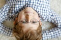 Close-up portrait of little blond kid boy with brown eyeglasses Royalty Free Stock Photo