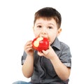 Close-up portrait of a little boy eating red apple Royalty Free Stock Photo