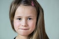 Close up portrait of little child girl with funny face expression Royalty Free Stock Photo