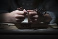 Close up portrait of little child girl praying with wooden rosary. Horizontal image Royalty Free Stock Photo