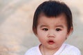Close up portrait little girl. Cute adorable asian little girl play in park with sun ray background. Happy baby girl play in Royalty Free Stock Photo