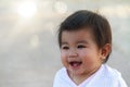 Close up portrait little girl. Cute adorable asian little girl play in park with sun ray background. Happy baby girl play in Royalty Free Stock Photo