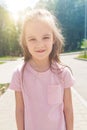 Close up portrait of a little girl she is cute attractive sweet sweet curious cheerful smiling at camera Royalty Free Stock Photo