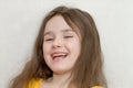 The close up portrait of little girl`s face with missing front lower milk teeth in a smiling mouth Royalty Free Stock Photo