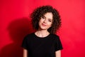 Close-up portrait of lovely cheery cute wavy-haired girl posing isolated over vibrant red color background Royalty Free Stock Photo