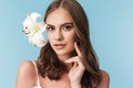 Close up portrait of a lovely young girl with lily flower Royalty Free Stock Photo