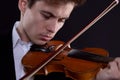 Close-up portrait of a man playing the violin in a live performance Royalty Free Stock Photo