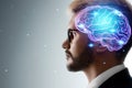 Close up portrait of a man from the side in profile and a hologram of a working brain. The concept of intelligence, brain work, Royalty Free Stock Photo