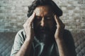 Close up portrait of man touching his head and temples for headache or problems to solve. Bad migraine and health problems. People Royalty Free Stock Photo