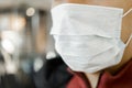 Close-up portrait of man wearing surgical mask to prevent from virus Royalty Free Stock Photo