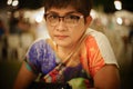 Close up portrait of mature asian woman smile and looking at camera with blurred background,selective focus,filtered image Royalty Free Stock Photo