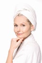 close-up portrait of mature woman in bath robe and towel on head Royalty Free Stock Photo