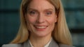 Close Up Portrait of Middle-aged Caucasian lady Adult Woman Posing for Camera in Creative Office Smile Toothy. Cheerful Royalty Free Stock Photo